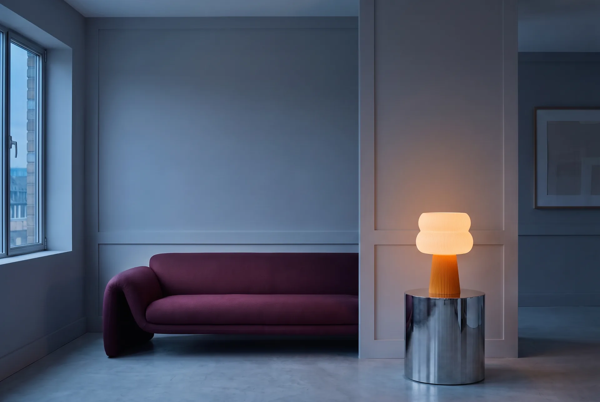 A living room at dusk, lit by a single warm lamp