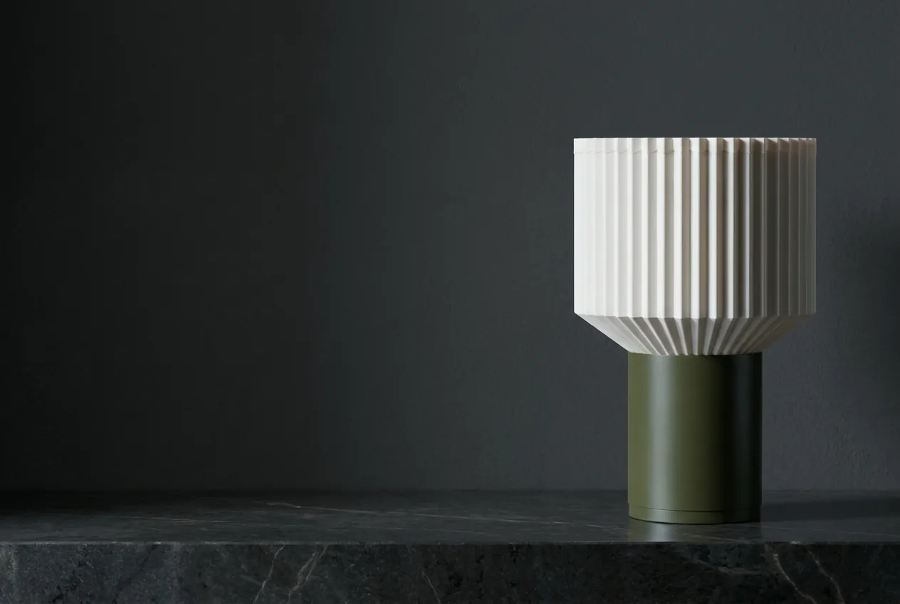 Colonna on a stone plinth in a dark showroom