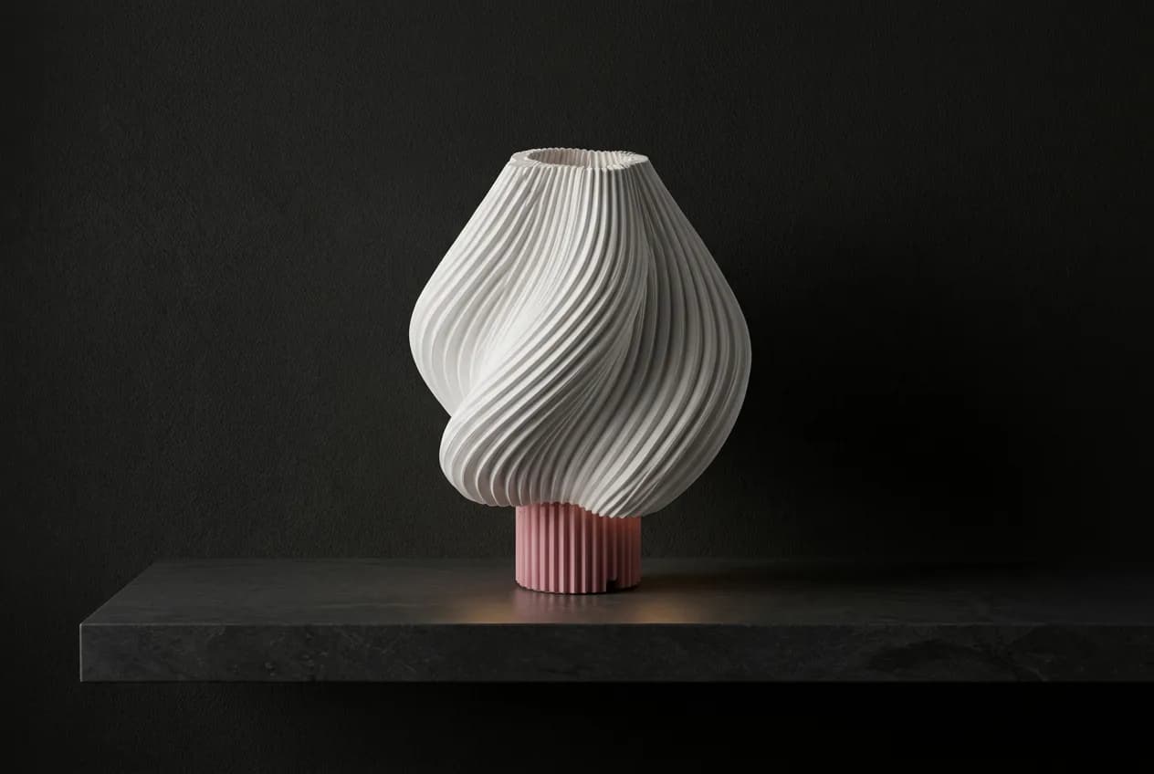 Rosalie on a stone plinth in a dark showroom